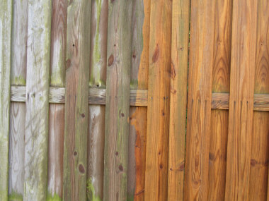 Before and after powerwashed fence